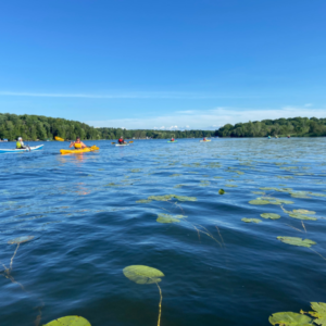 Kayakers on Intermediate Lake in the Upper Chain of the Chain of Lakes Water Trail